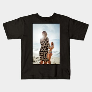 Two Young Pretty Blond Girls Holding Hands and Laughing Together on Sunny Beach Kids T-Shirt